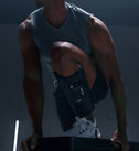 Athlete in a gym wearing Normatec Lower Legs
